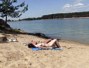 2 steamy russian young getting a suntan on the free beach. 2