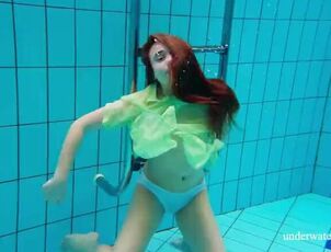 Furry virgin stunner Nina Mokhnatka swims in the pool